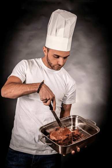 a man prepares meat for potency